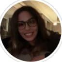 dark haired girl with glasses