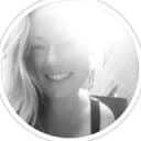 girl with blonde hair in front of a bright light