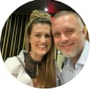 a couple smiling while out to dinner